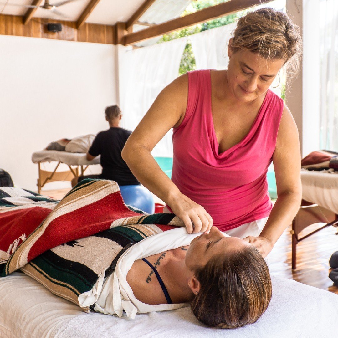 Massage Therapist Adjusting Massage Covers  