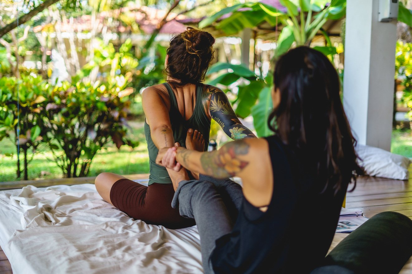 Massage Therapist Pulling Arms For Relaxation